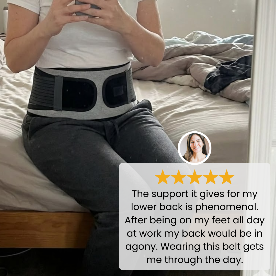 back brace worn indoors while seated on a bed in a casual home setting