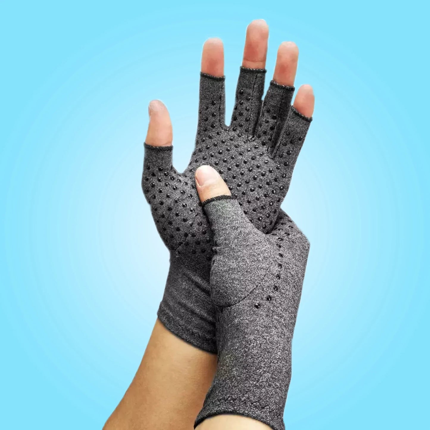 Hand wearing compression gloves with dotted grip design, ideal for gloves for arthritic hands, hand compression gloves, compression gloves for hand swelling, and gloves for arthritis in the hands.