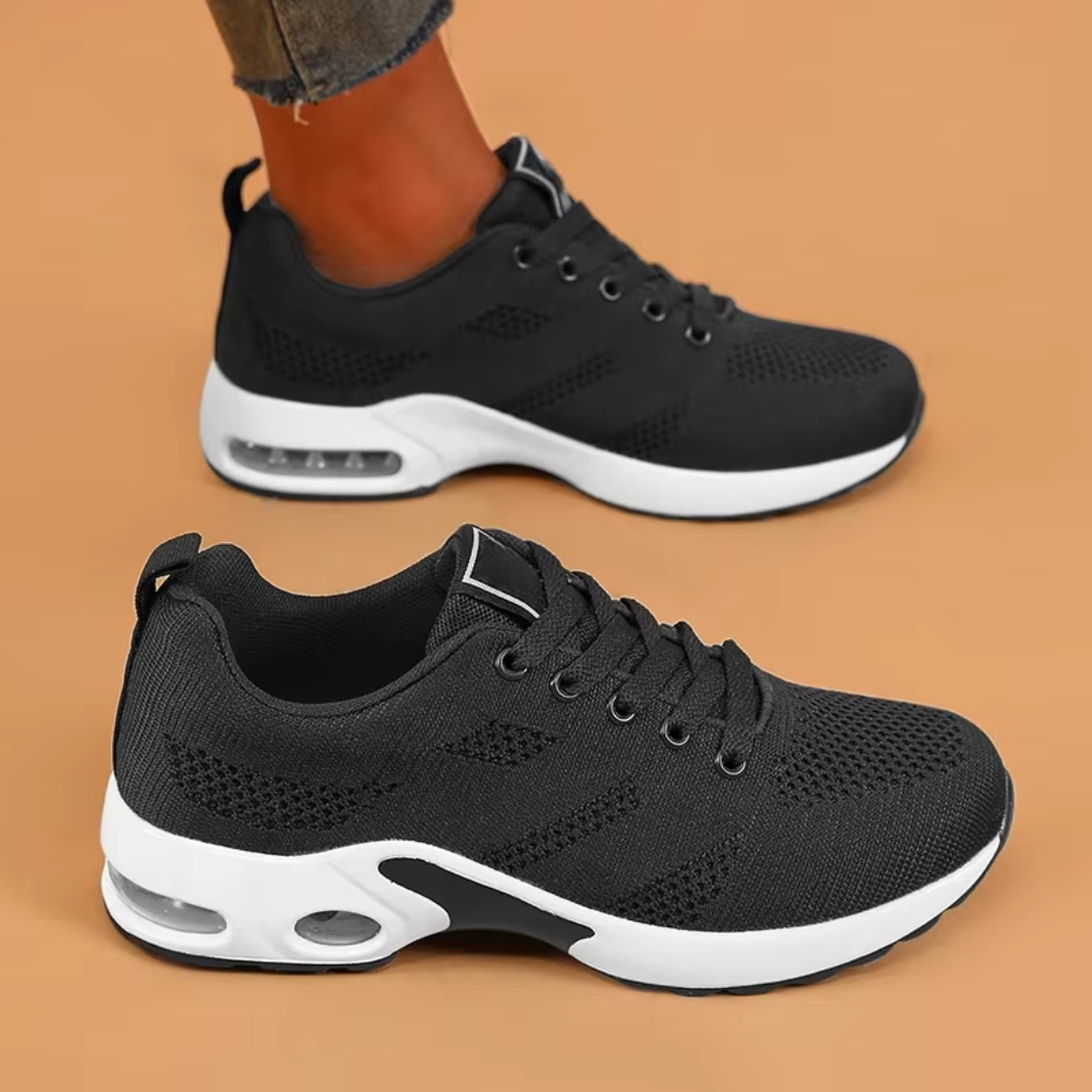 orthopedic shoes shown as a black pair from the side on a neutral background