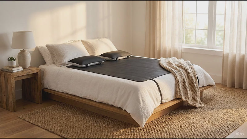WeRelieve Earth Grounding Mat placed on a bed for grounding therapy during sleep to help improve relaxation and sleep quality.