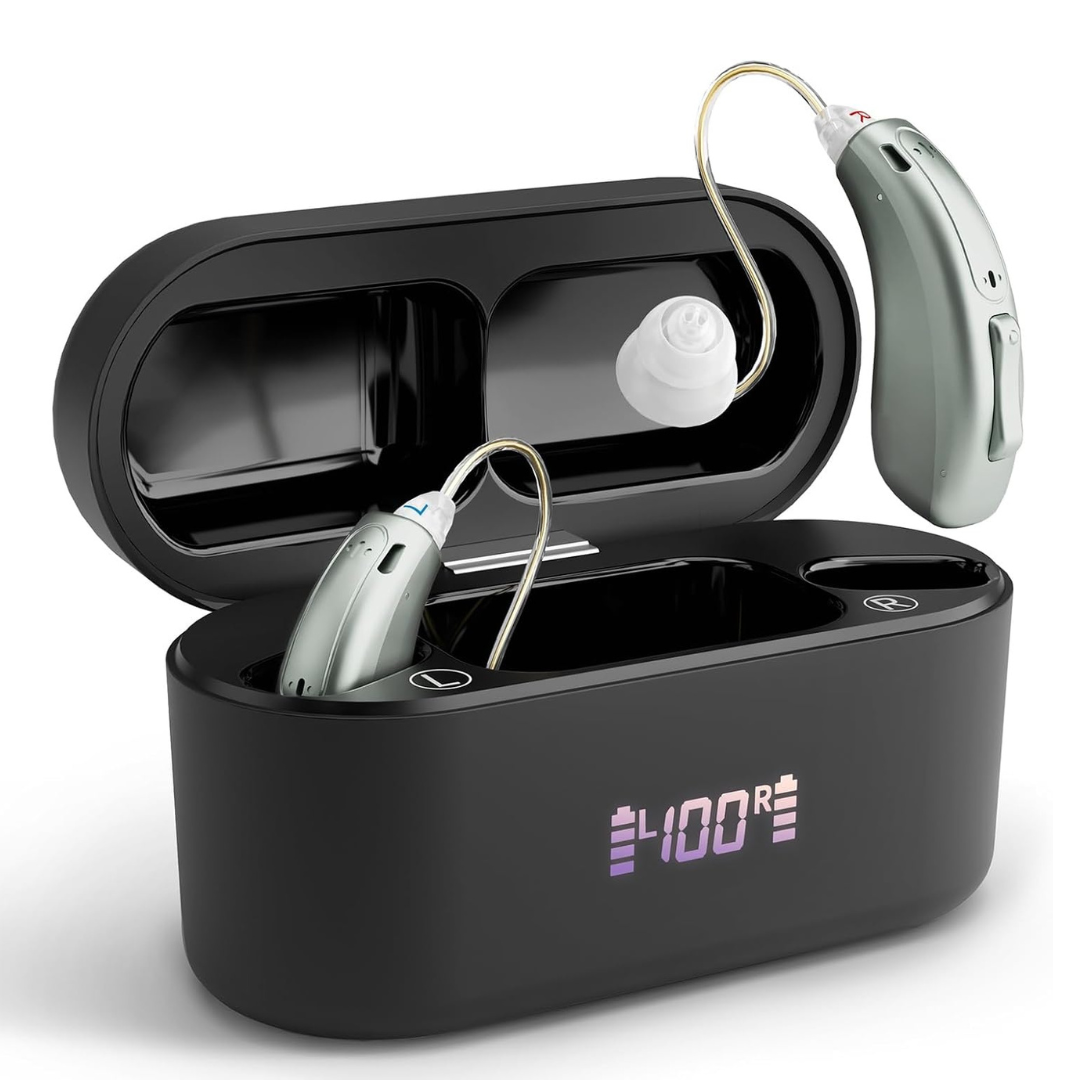 Close-up of a pair of silver WeRelieve rechargeable OTC hearing aids alongside their black portable charging case. The front of the case features a clear digital LED display showing a 100% battery charge. Designed as one of the best hearing aids for multi-day reliability and ease of use.